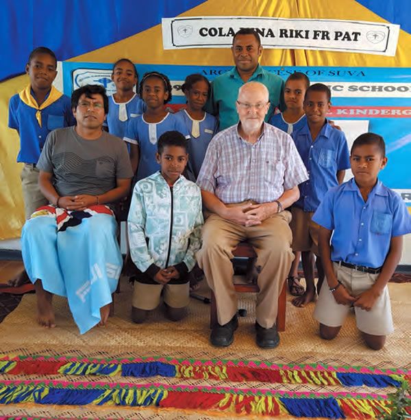 Fr. Patrick (center)