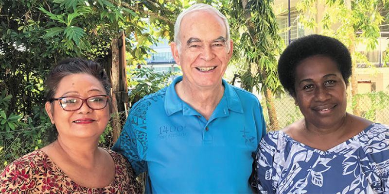 Fr. Frank, with Lilian (left) and Vitalina (right)